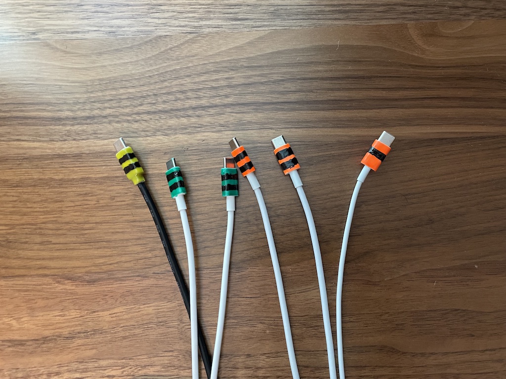 a collection of cable tips badly painted with nail polish